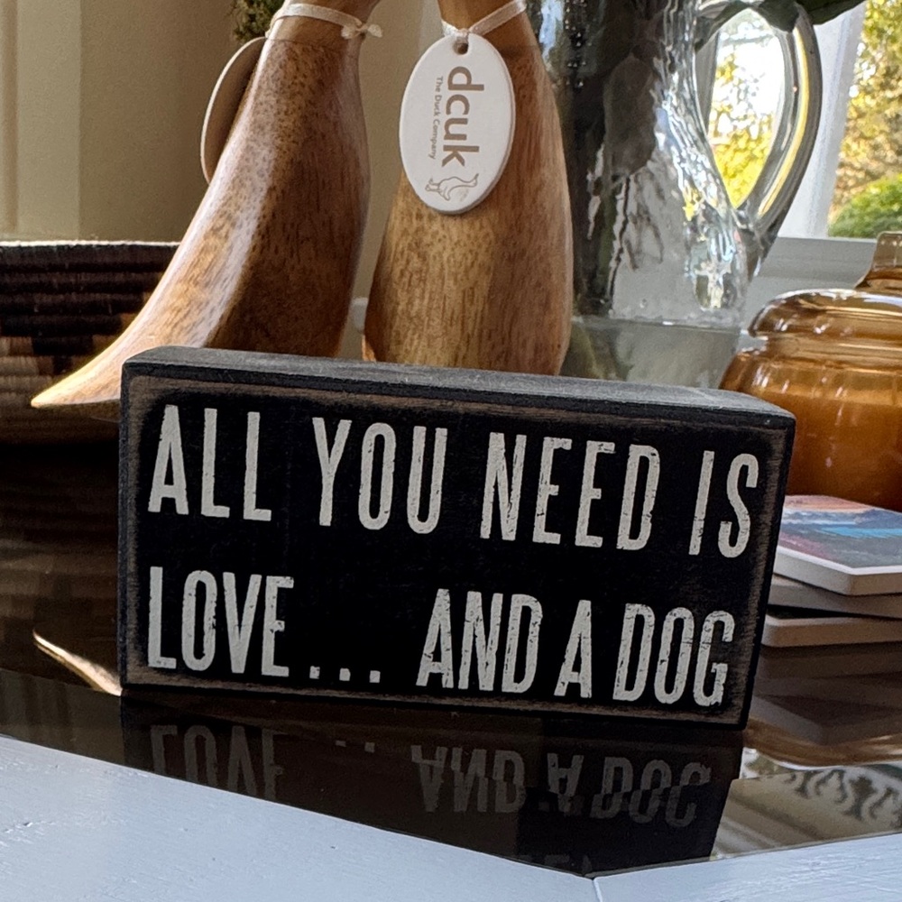 “all you need is love and a dog” sign